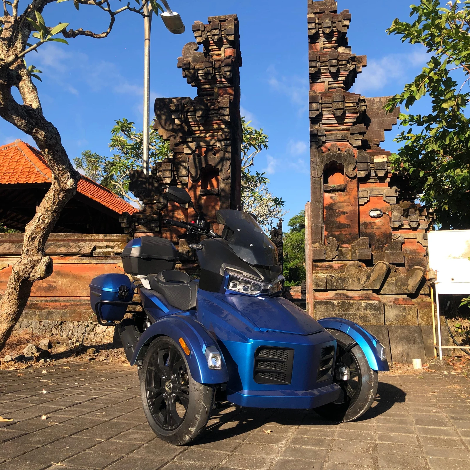 Blue Moratti beside a Balinese gateway